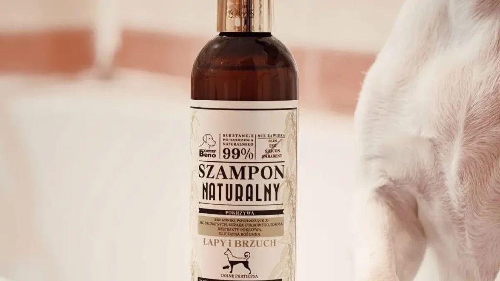 dog owner applying shampoo to dog coat
